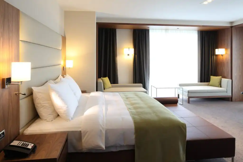 A bedroom with a bed and a couch.